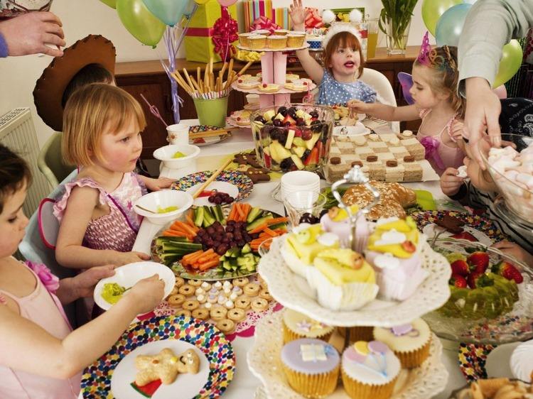 kids birthday party with delicious treats on the table