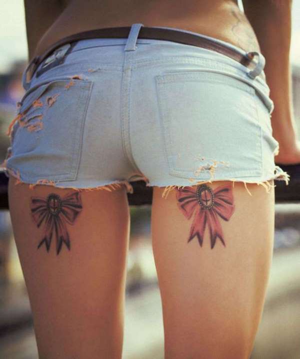 ribbon tattoo on thighs ideas for women