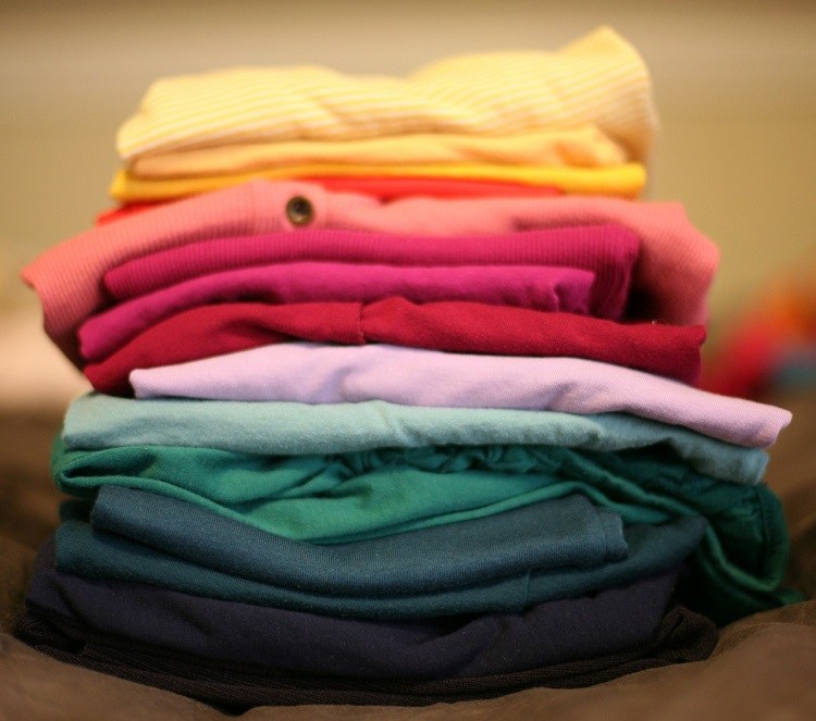 stacked laundry t shirts and clothes