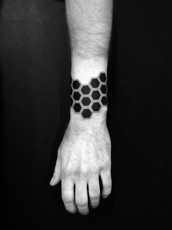 symmetrical hexagonal wrist honeycomb tattoo design
