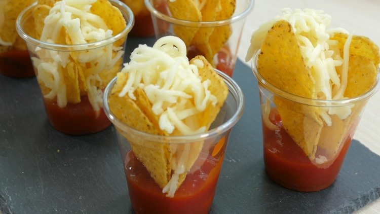 tortilla chips salsa dip with cheese in glass