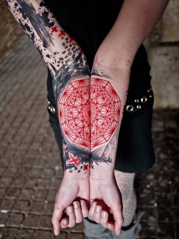 trash polka symmetrical tattoo on forearm