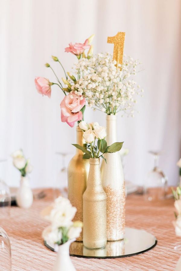 wedding table centerpiece ideas gold painted bottles and flowers