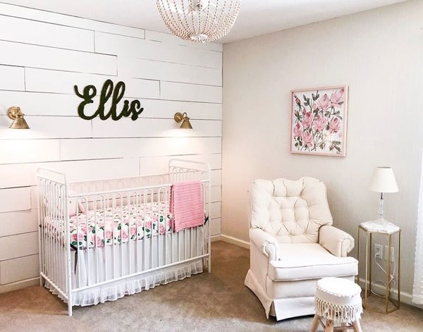 baby girl nursery ideas shiplap wall white crib pink accents