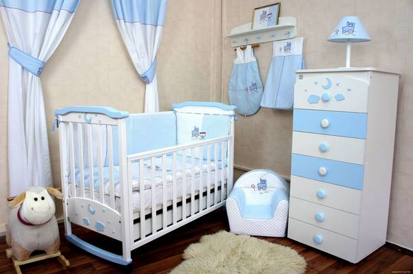 blue white furniture and textile in nursery room