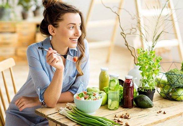 diet and nutrition hair care tips young woman eating vegetables