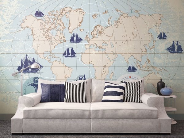 nautical themed decor in living room with map wallpaper and sofa pillows