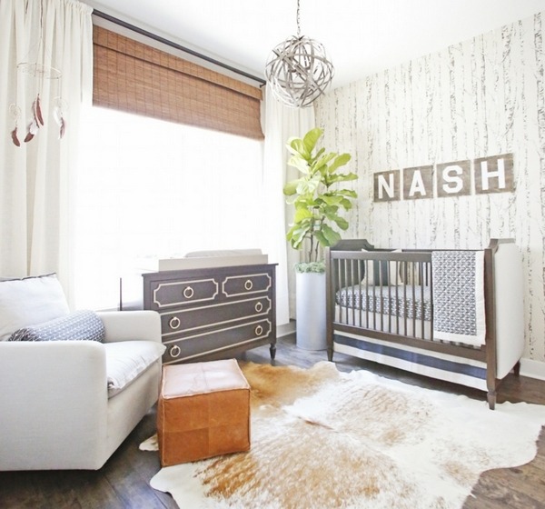 rustic decoration in baby nursery with cowhide rug