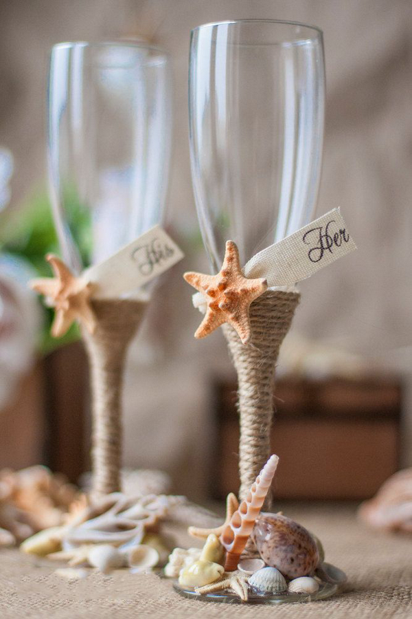 beach wedding ideas decoration DIY bride and groom toasting flutes
