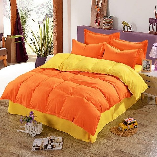 bright bedding set in orange and yellow colors to create vivid atmosphere