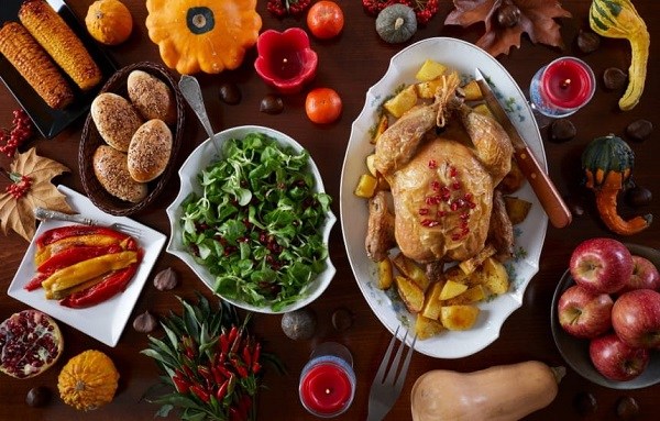 festive thanksgiving dinner with roasted turkey and side dishes