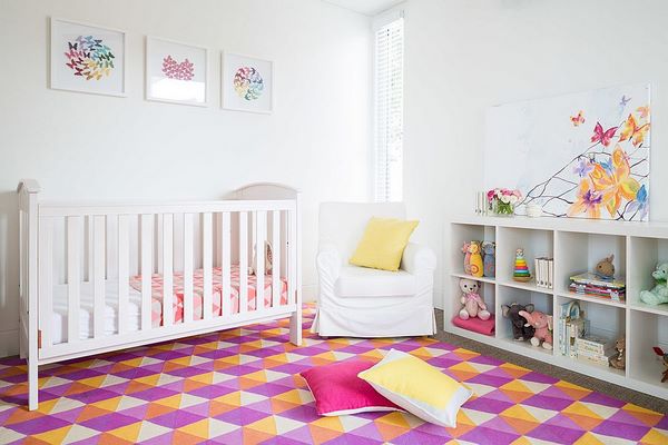 nursery room ideas white furniture colorful carpet with geometric pattern