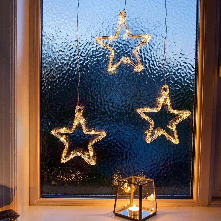 Christmas window decor ideas LED lights stars and lantern