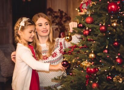 Mother-and-daughter-decorating-Christmas-tree