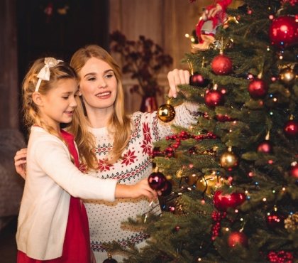 Mother-and-daughter-decorating-Christmas-tree