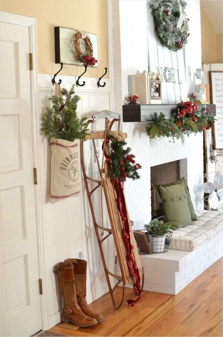 rustic Christmas entryway decor ideas sledge and evergreens
