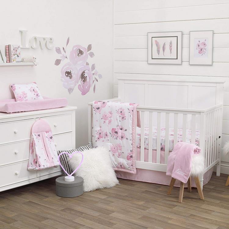 white and pink baby girl room with floral themed decor