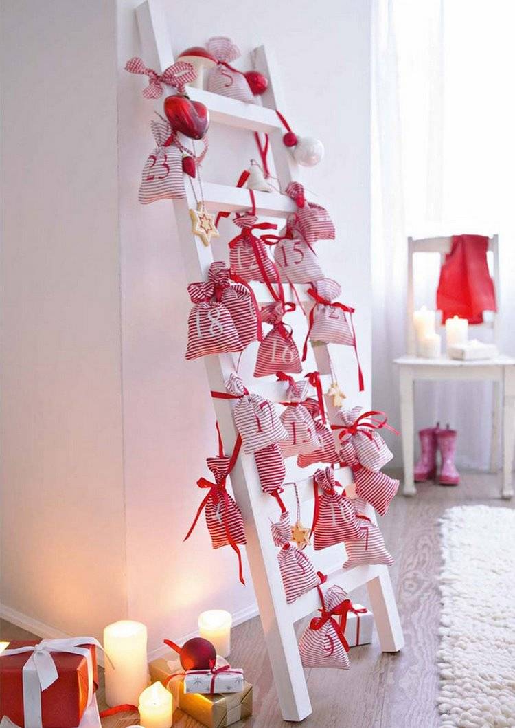white and red Christmas decor ideas ladder and fabric bags as advent calendar