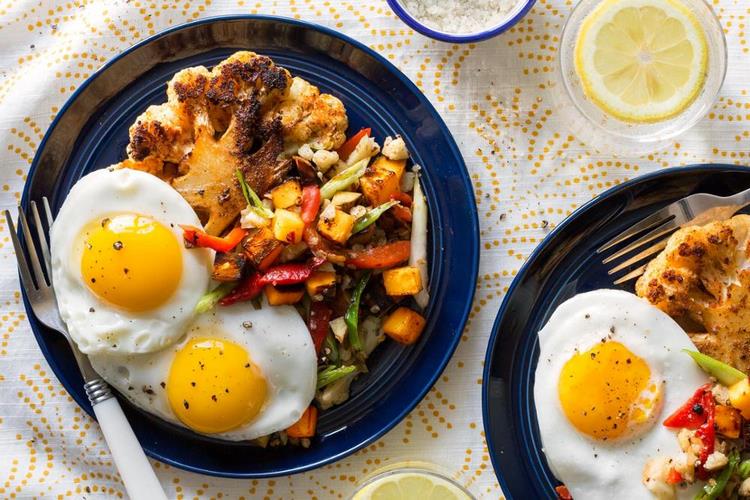 Cauliflower steaks with fried eggs and potato hash