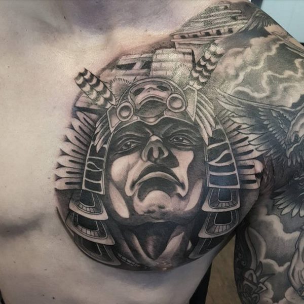 awesome Aztec tattoo on shoulder and chest