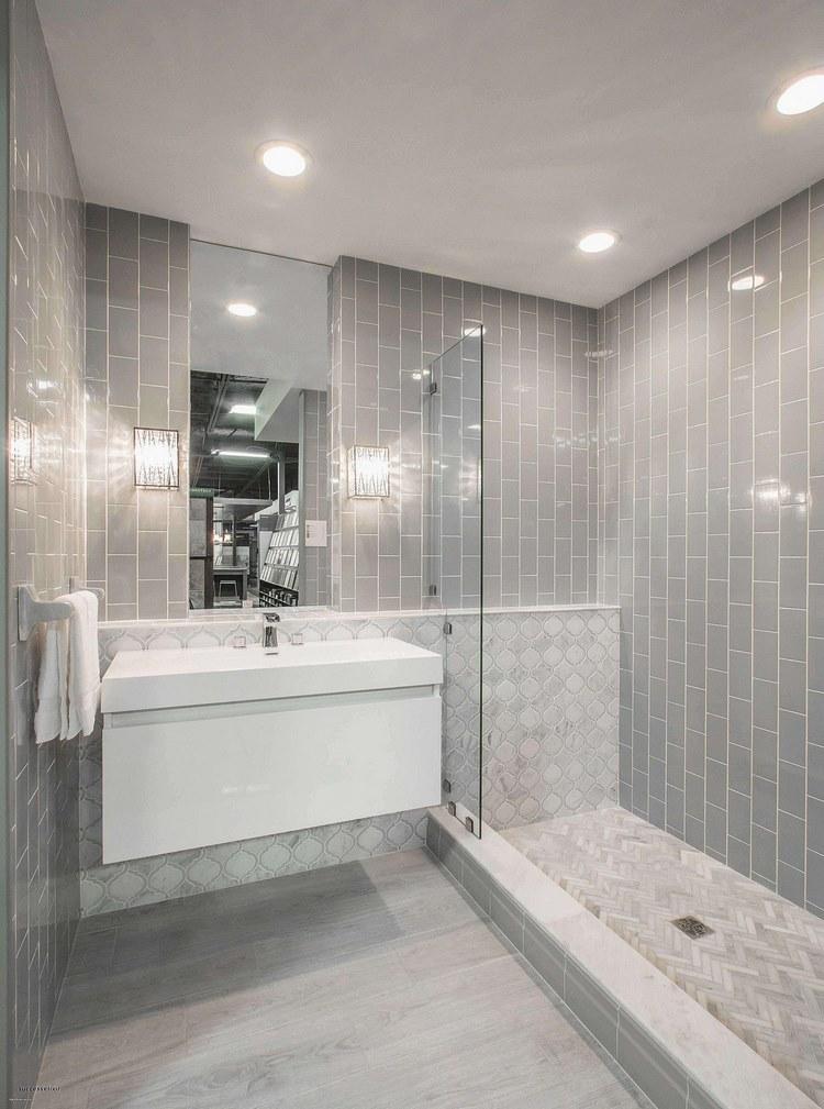 small bathroom with walk in shower along the wall