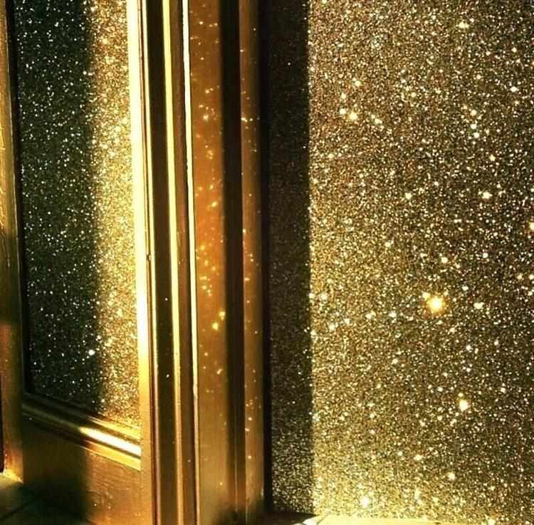 gold glitter paint accent wall as focal point in home interior