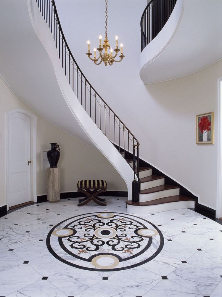 house entry decorative marble floor and staircase