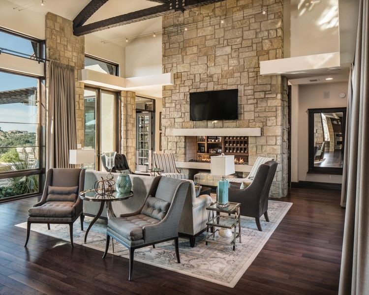 living room design with dark floor stone fireplace