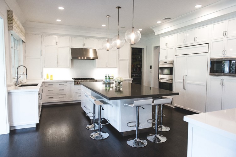 white kitchen and dark wood flooring