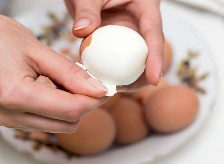 peeling eggs for making deviled eggs