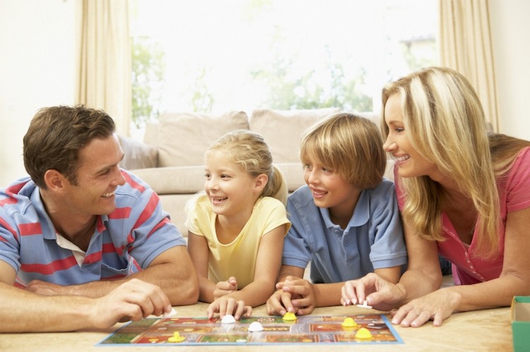 indoor activities during coronavirus quarantine family with children playing board games 