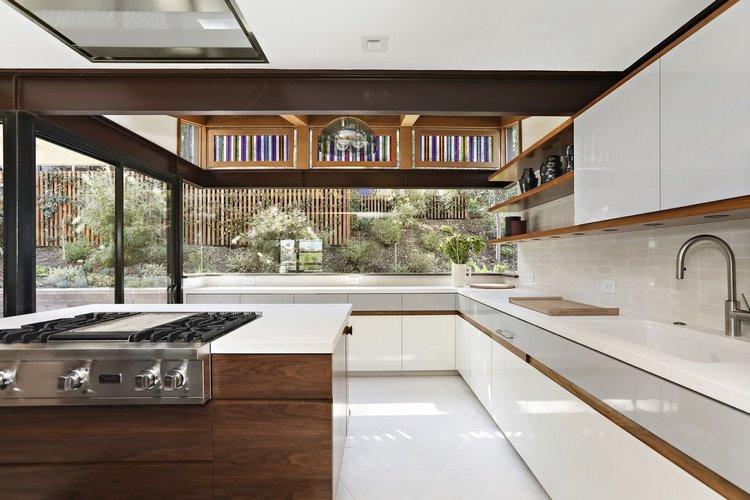 white floor in contemporary kitchen and white cabinets