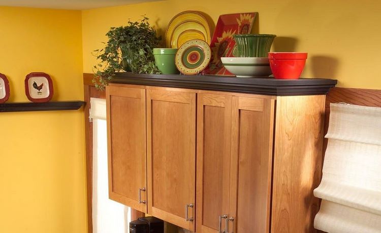 how to decorate above the cabinets in your kitchen