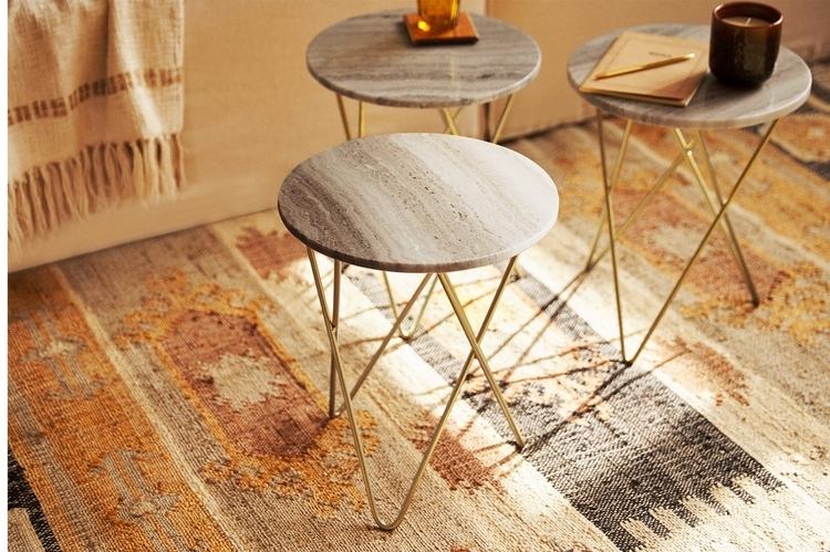 round side table with marble top and hairpin legs in gold