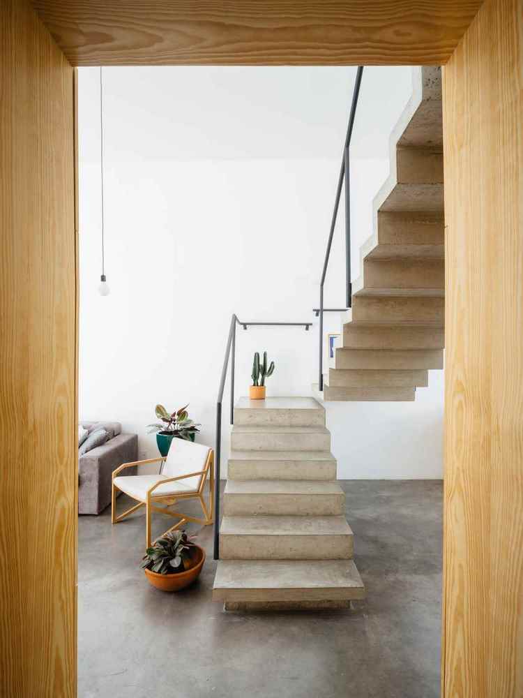 modern concrete staircase and polished concrete flooring