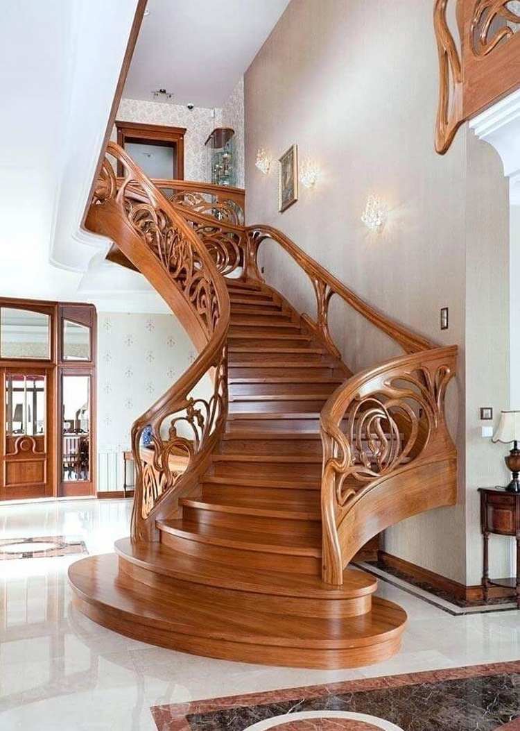 elegant home with spectacular staircase carved wood railings