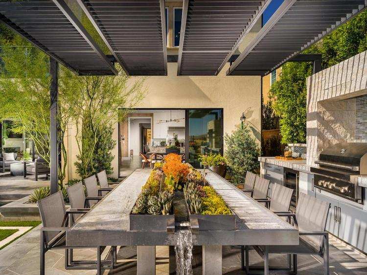 patio design with outdoor kitchen and big dining table