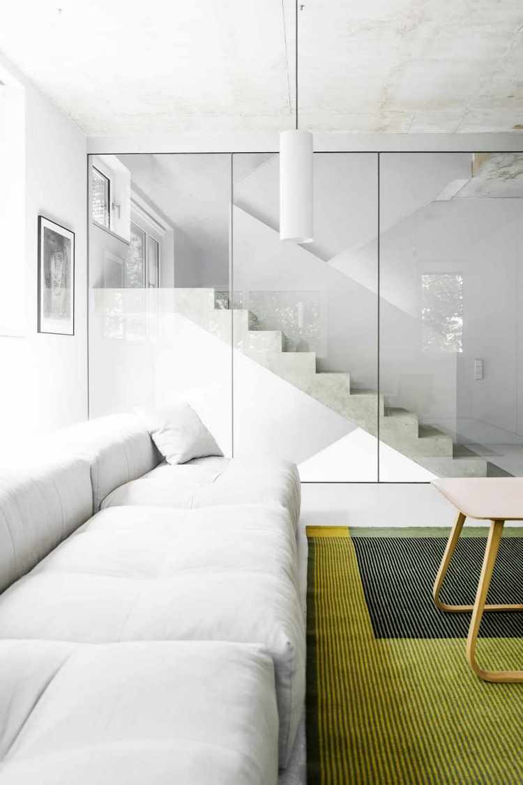 simple concrete glass staircase white decor green carpet