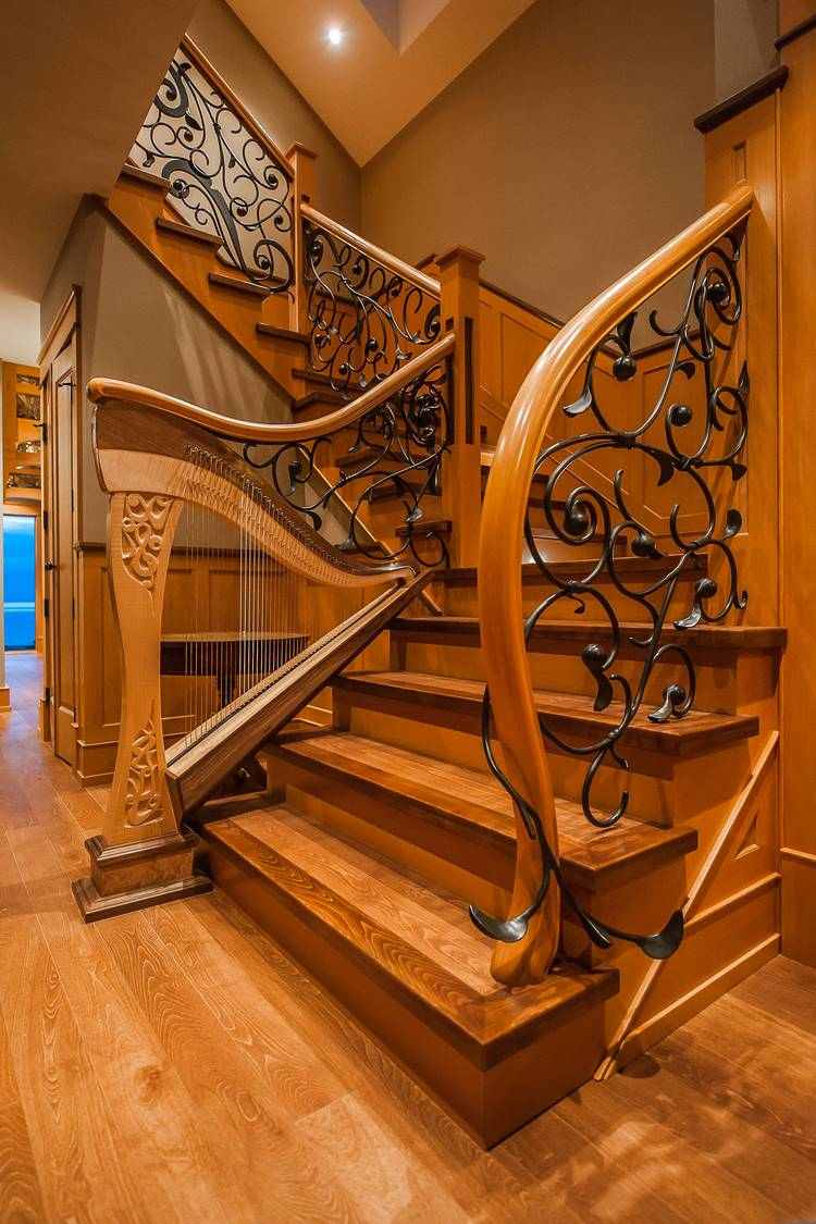 unique wood and wrought iron staircase railing harp