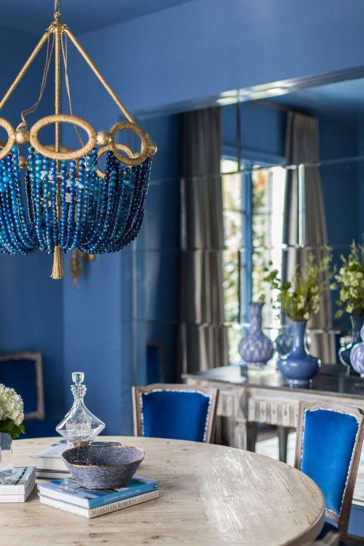 beaded chandelier in blue and gold dining room