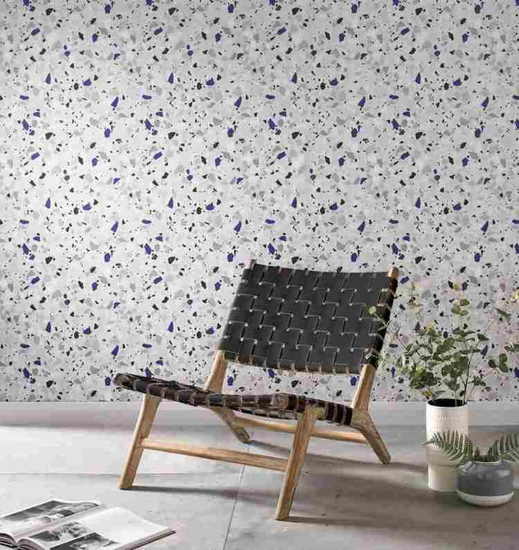 designer chair as accent in the living room in front terrazzo wall covering