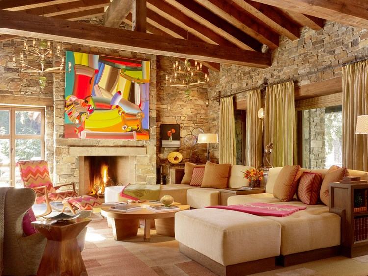 eclectic decor in living room with stone wall and exposed ceiling beams