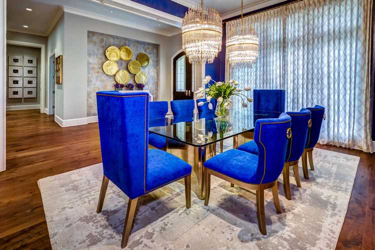 formal dining room design in blue with gold accents