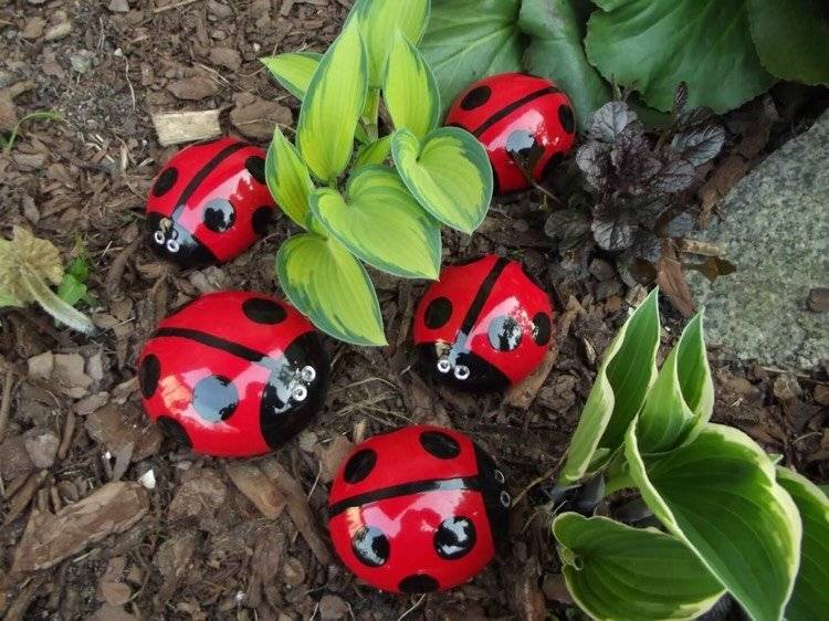 garden decoration with painted rocks ladybugs