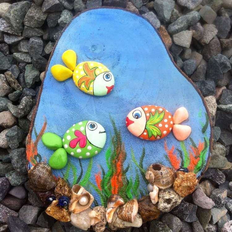 garden decoration with rocks fish and sea bottom