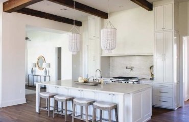 white-kitchen-with-two-chandeliers-above-kitchen-island