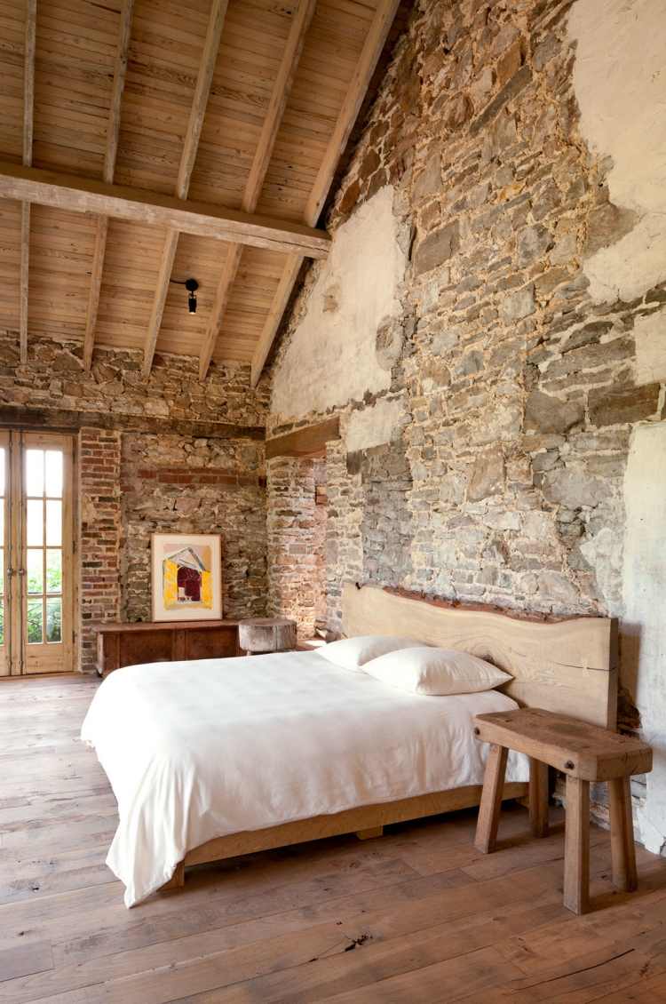 bedroom feature walls rustic interior design stone and plaster