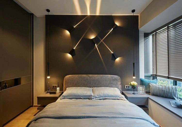 bedroom design with dark accent wall and original lighting
