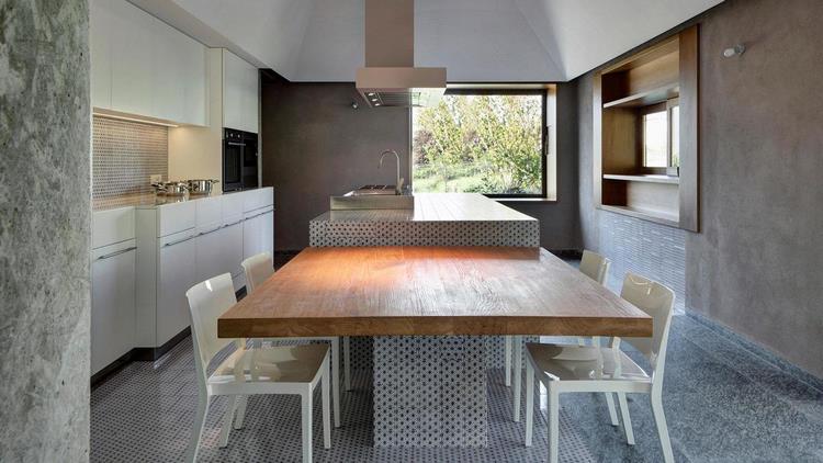 contemporary kitchen design island with cantilevered wooden dining table