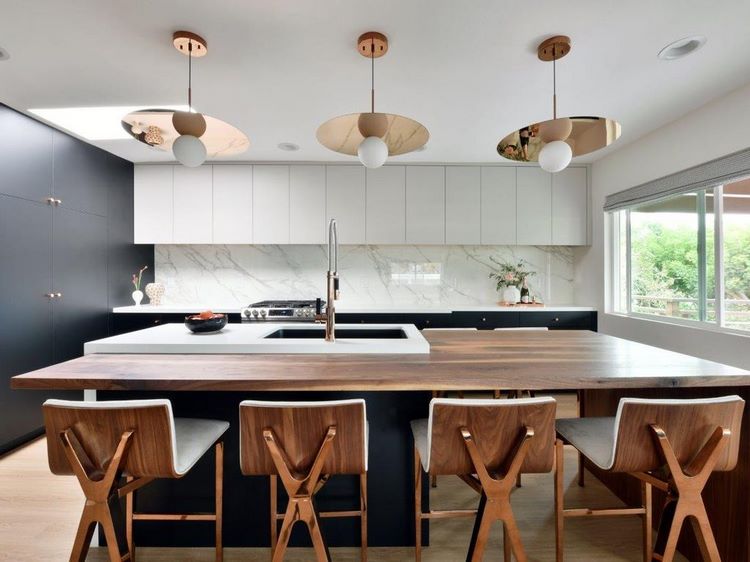 contemporary kitchen design with large island with dining table